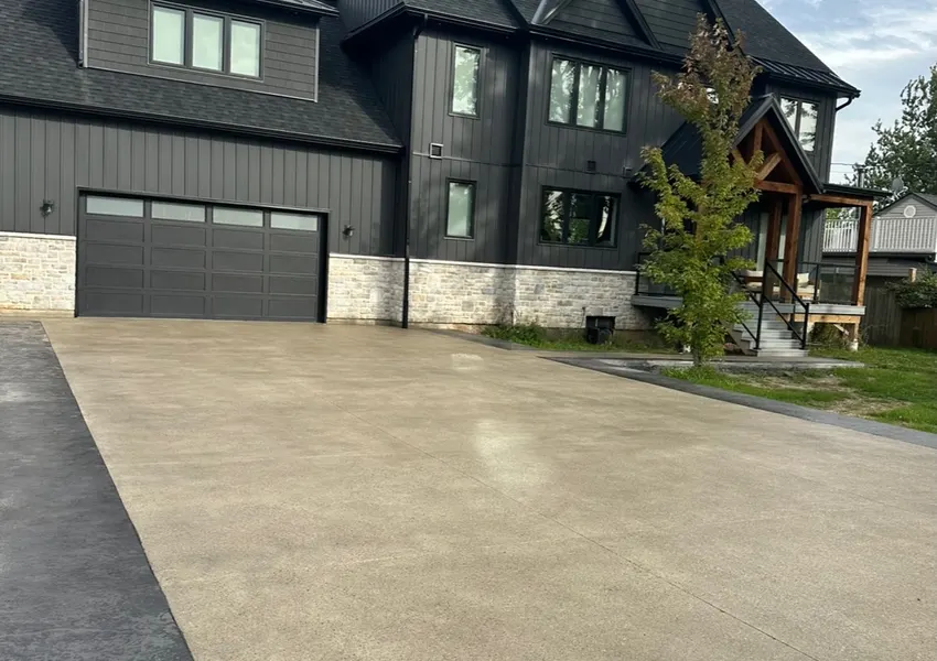 Wide new concrete driveway at a modern home
