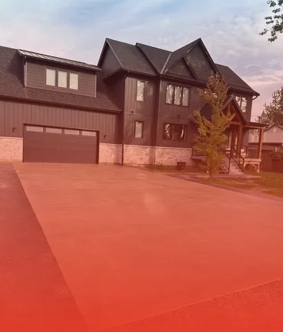 New concrete driveway at a modern home in Tulare County
