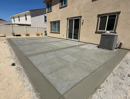 Patio extension formed along a stucco home