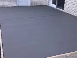 Fresh patio slab inside wood forms