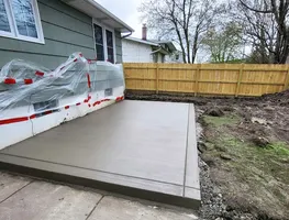 Patio slab with fence going in behind it