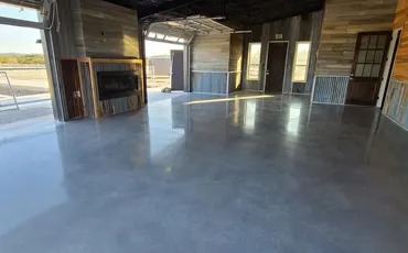 Glossy stained and sealed concrete shop floor