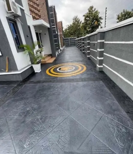 Stamped concrete courtyard with a decorative inlay by Valley Ridge Concrete