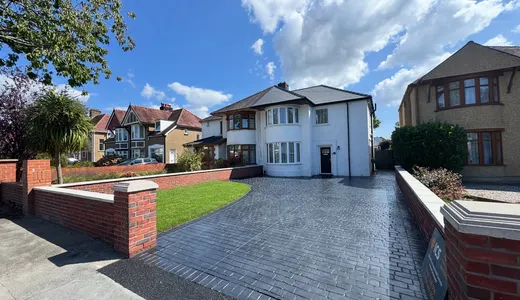 Charcoal stamped concrete front driveway