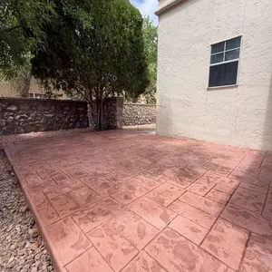 Red stamped concrete side patio