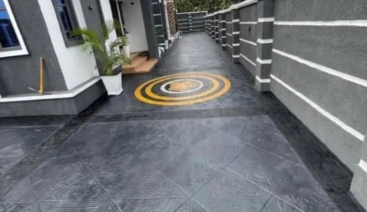 Stamped concrete courtyard with a decorative inlay